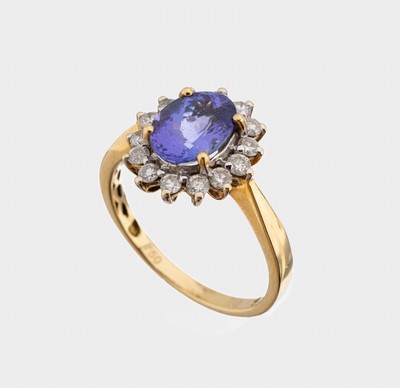 18 kt Gold Tansanit-Brillant-Ring, GG 750/000, mittig ovalfacett. 1.50 ct, umgeben von 14 Brillanten zus. ca. 0.50 ct Weiß/p, RW 57, ca. 3.9 g