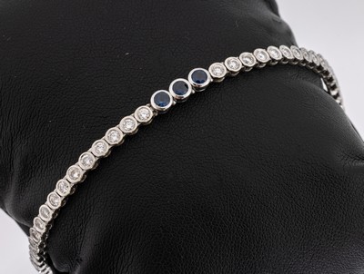 14 kt Gold Brillant-Saphir-Armband, WG 585/000, 51 Brillanten, 1 Stein fehlt, zus. ca. 3.00 ct Weiß/si, 3 rundfacett. Saphire zus. ca. 0.25 ct, L. ...