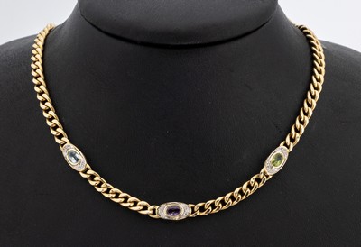 14 kt Gold Farbstein-Diamant-Collier, GG 585/000, schlichte Gestaltung, Mittelteil mit 3 ovalen Gliedern, 1 ovalfacett. Peridot, 1 ovalfacett. ...