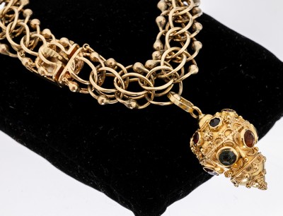 14 kt Gold Armband mit 18 kt Gold Anhänger, GG 585/000 und 750/000, Anhänger in Form eines Lampions mit Farbsteinbesatz, ca. 39.9 g, L. ca. 19 cm, ...