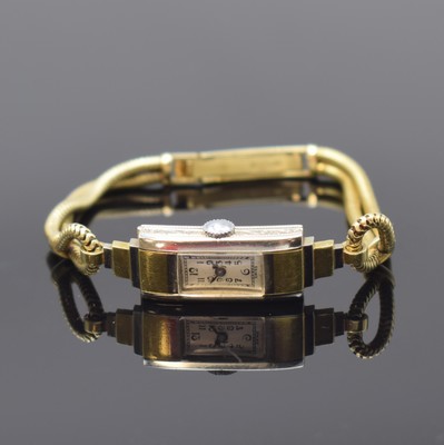 Art-Deco Damenarmbanduhr in WG/GG 750/000, Handaufzug, Schweiz um 1930, Goldband in GG 585/000, Scharnierboden, silb. Zifferbl. m. arab. Zahlen, ...
