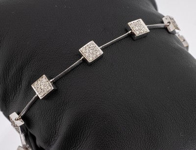 18 kt Gold Diamant Armband, WG 750/000, 89 Brillanten in quadratischen Elementen gefasst zus. ca. 1.0 ct Weiß-l. get. Weiß/si- p1, L ca. 20 cm, ...