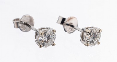 Paar 14 kt Gold Brillant-Ohrstecker, 2 Brillanten zus. ca. 0.70 Weiß-l.get.Weiß/si-p