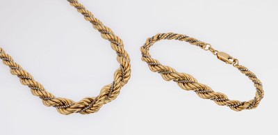 18 kt Gold Schmuckset, GG/WG 750/000, best. aus: Collier und Armband, Kordelmuster, L. ca. 19.5 und 50 cm, Karabinerschließe, ca. 51.6 g