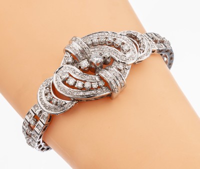Prunkvolles 18 kt Gold Diamant-Armband, 1950erJahre, WG 750/000, geschwungenes MittelteilAufbau in mehreren Ebenen, 178 Brillanten und 8/8-Diamanten ...
