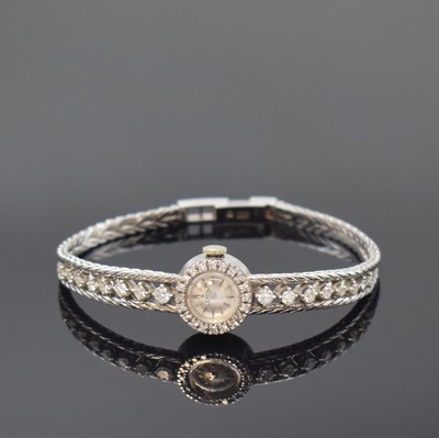 EBEL Damenarmbanduhr in WG 750/000 mit Diamanten, Schweiz um 1965, Handaufzug, 2- teil. Geh., Boden aufgedr., Lün. wie Band aufw. m. Diamanten bes., ...