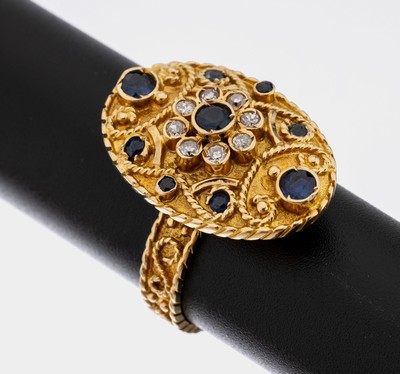 18 kt Gold Saphir-Diamant-Ring, GG 750/000,ovaler Ringkopf, bes. mit 9 rundfacett. Saphiren zus. ca. 0.30 ct, 8 8/8-Diamanten zus. ca. 0.16 ct ...