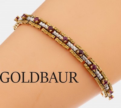 18 kt Gold GOLDBAUR Rubin-Armband, GG/WG 750/000, 19 rundfacett. Rubine, typ. aufwändige Verarbeitung, L. ca. 18 cm, Kastenschloss mit ...
