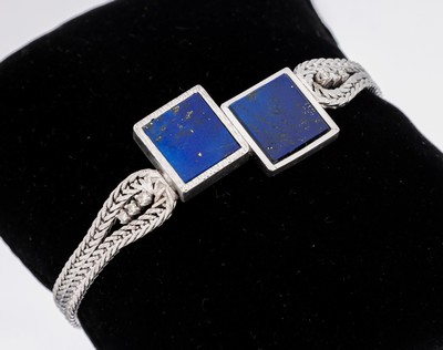 14 kt Gold Lapislazuli-Diamant-Armband, WG 585/000, Mittelteil mit 2 eingelegten Lapislazuliplatten, seitl. flankiert von kl. Diamantbesatz, L. ca. ...