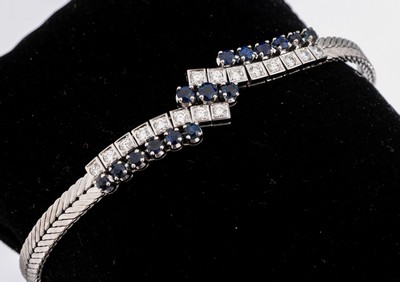 18 kt Gold Saphir-Brillant-Armband, WG 750/000, 15 rundfacett. Saphire zus. ca. 1.50 ct, 16 Brillanten zus. ca. 0.75 ct feinesWeiß/si, ca. 22 g, L ...