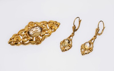 Farbstein-Schmuckset, 835er Silber vergoldet, best. aus: 1 Brosche, L. ca. 5.4 cm, ovalfacett. Rauchquarz, und 1 Paar Ohrhänger, L. ca. 3.5 cm, ...