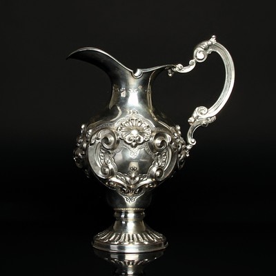 Kanne, wohl Polen, um 1880-90, Silber, reich reliefiert mit Muschel- und Rocaillen- Dekor, punziert, H. ca. 23cm, ca. 550 g.