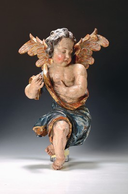 Putto, süddeutsch, 2. Hälfte 19. Jh., nach barockem Vorbild, Lindenholz geschnitzt und polychrom und goldfarben gefaßt, H. ca. 54cm
