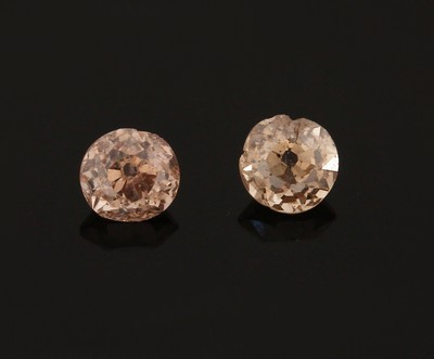 Lot 2 lose Diamanten, zus. 0.51 ct getönt/p 1, Ausfassware, Rundiste besch.