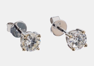 Paar 14 kt Gold Brillant-Ohrstecker, WG 585/000, 2 Brillanten zus. ca. 0.77 ct Weiß/vs-si