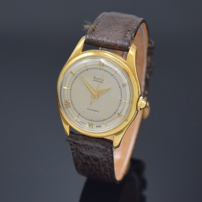 ALPHA Armbanduhr mit Hammerautomatik in GG 750/000, Schweiz um 1945, Boden aufgedr., silb. Duoton-Zifferbl. pat., aufges. gold. röm. Zahlen u. ...
