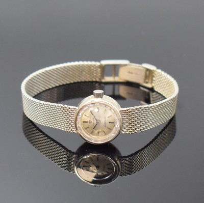 OMEGA Damenarmbanduhr Ladymatic in WG 585/000, Schweiz um 1970, Automatik, 2-teil. Geh., Milanaiseband, Boden aufgedr., silb. Zifferbl. m. aufgel. ...