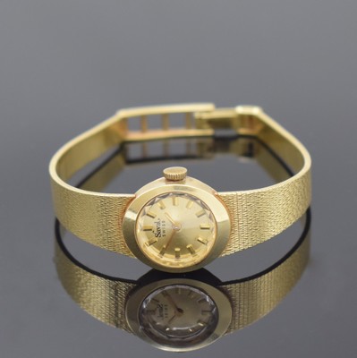 SAVAL Damenarmbanduhr in GG 585/000, Schweiz um 1965, Handaufzug, Goldband, Boden aufgedr., goldfarb. Zifferbl. m. aufges. Std.-Ind., gold. Zeiger, ...
