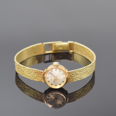NORVINA Damenarmbanduhr in GG 585/000, Schweiz um 1965, Handaufzug, Goldband, Boden aufgedr., silb. Zifferbl. m. aufges. Std.- Ind., gold. Zeiger, ...