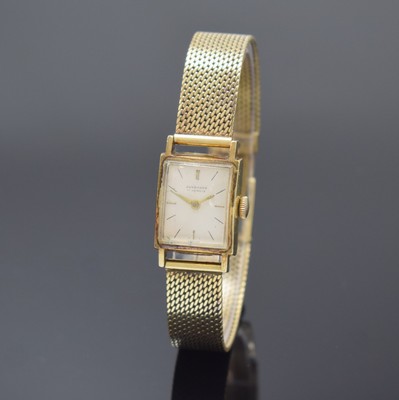 JUNGHANS Damenarmbanduhr in GG 585/000, Deutschland um 1965, Handaufzug, Goldband, Boden aufgedr., silb. Zifferbl. m. gold. Zeiger, Kal. 71, M. ca. ...