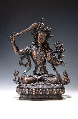 Bodhisattva/Manjushri, Nepal, 20. Jh., Kupferlegierung, mit erhobenem Schwert und Lotus, auf Lotussockel, H. ca. 30 cm