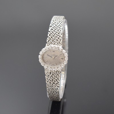 OMEGA Damenarmbanduhr in WG 750/000 mit Diamantbesatz, Schweiz um 1969, Handaufzug, orig. Goldband, Lünette aufw. m. Diamanten bes., Boden aufgedr., ...