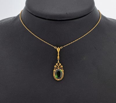 14 kt Gold Turmalin-Collier, GG 585/000, feine filigrane Arbeit, bewegl. Mittelteil, ovalfacett. Turmalin, L. ca. 45 cm,. Federringschließe, ca. ...