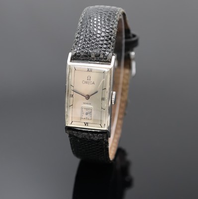 OMEGA Herrenarmbanduhr, Schweiz um 1940, Edelstahlgeh., Boden aufgedr., silb. Zifferbl. rest., gebl. Stahlzeiger, 15 St., Formankerw., Kal. T17, ...