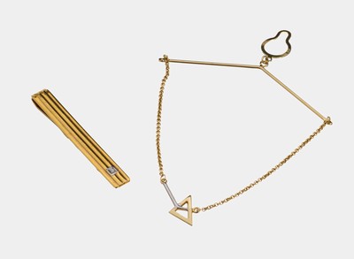 Konvolut 8 kt Gold Herrenschmuck, GG 333/000, best. aus: 1 Krawattenklammer, geriffelt, 1 kl. 8/8-Diamant, L. ca. 5.5 cm, und 1 Krawattenkette, ...