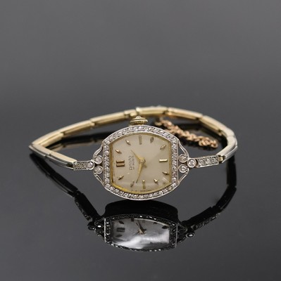 ARISTO diamantbesetzte Art-Deco Damenarmbanduhr in GG 585/000, Schweiz um 1920, Handaufzug, Band in GG/WG 585/000 m. Sicherheitskettchen, Lünette, ...