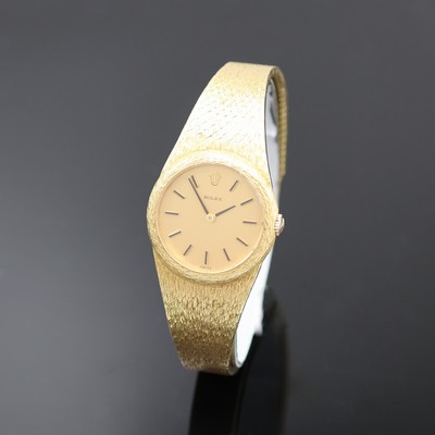 ROLEX Damenarmbanduhr in GG 750/000, Schweiz um 1965, Handaufzug, Boden aufgedr., orig. Goldband, Champagnerfarb. Zifferbl. m. aufges. Std.-Ind., ...