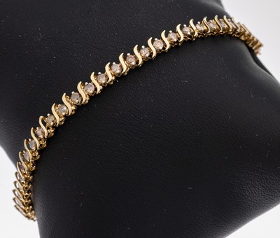 14 kt Gold Brillant-Armband, GG 585/000, 42 Brillanten zus. ca. 1.26 ct Braun/p, L. ca. 15.5 cm, Kastenschloss mit Sicherheitsacht, ca. 5.5 g