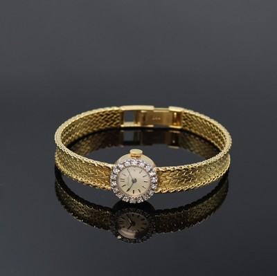 ZENTRA Damenarmbanduhr in GG 750/000 mit Diamanten, Schweiz um 1965, Handaufzug, Goldband, Boden aufgedr., Lünette aufw. m. Diamanten bes., silb. ...