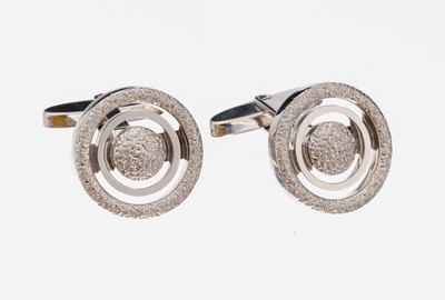 Paar 18 kt Gold Manschettenknöpfe, WG 750/000, runde Platte mit mehreren Kreisen, z.T. punziert und pol., ausgefallenes Design, ca. 15.3 g