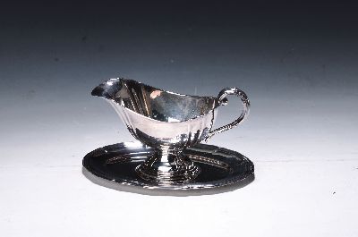 Sauciere, deutsch, wohl 30er Jahre, deutsch, 835er Silber, doppelte Vierpassform, mehrfach profilierter Rand, ca. 260g, ca. 12 x 20.5 cm