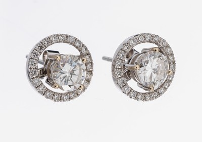 Paar 18 kt Gold Brillant-Ohrstecker, WG 750/000, 2 Brillanten zus. ca. 1.50 ct Weiß/si, abnehmbare Kränze mit Brillanten zus.ca. 0.31 ct ...