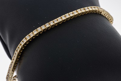 14 kt Gold Brillant-Linienarmband, GG 585/000, 76 Brillant zus. ca. 2.00 ct Weiß/si-p, L. ca. 18.2 cm, Kastenschloss mit Sicherheitsacht, ca. 9.9 g