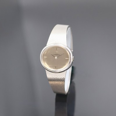 OMEGA Damenarmbanduhr in WG 585/000, Schweiz um 1971, Handaufzug, 2-teil. ovales Geh. m. Milanaiseband, Boden aufgedr., orig. Krone seitl. im Geh. ...