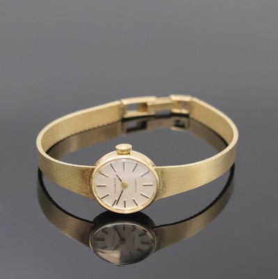 DUGENA Classic Damenarmbanduhr in GG 585/000, Schweiz um 1965, Handaufzug, Goldband, Boden aufgedr., silb. Zifferbl. m. aufges. Std.-Ind., geschw. ...