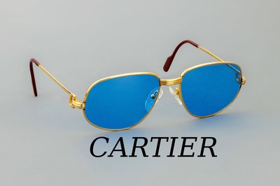 CARTIER Sonnenbrille, Trinity, Metall verg., Gr. 130, sign. und num., blau getönte Gläser, Bügel bordeauxfarb.