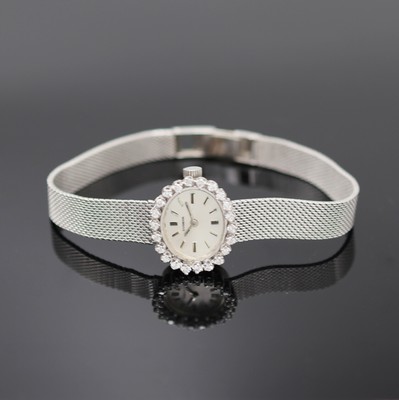 DUGENA diamantbesetzte Damenarmbanduhr in WG 585/000, Deutschland/Schweiz um 1970, Handaufzug, 2-tlg. Geh., Boden aufgedr., anges. Milanaiseband in ...