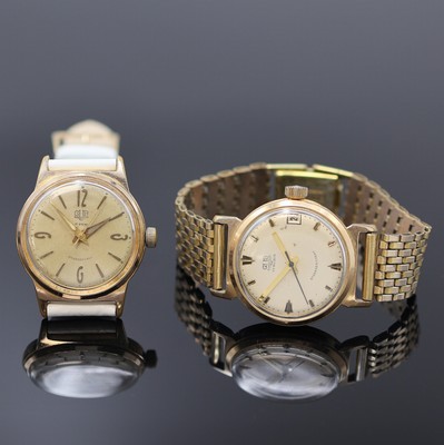 GUB 2 vergoldete Herrenarmbanduhren Kaliber 69.1/70.1, DDR um 1968, Handaufzug, 2-tlg. Geh. m. aufgedr. Stahlböden, silb. Zifferblätter pat./fl., ...