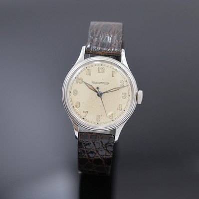 Jaeger-LeCoultre Armbanduhr in Stahl, Schweiz 1940er Jahre, Handaufzug, Boden aufgedr., vers. Zifferbl. m. arab. Leuchtzahlen altersbed. pat./fl., ...