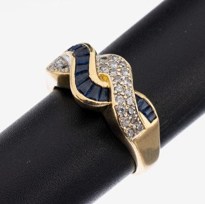 18 kt Gold Saphir-Brillant-Ring, GG 750/000, geschwungener Ringkopf, 14 eingeschliffene Saphire zus. ca. 0.25 ct, 23 Brillanten zus. ca. 0.12 ct ...