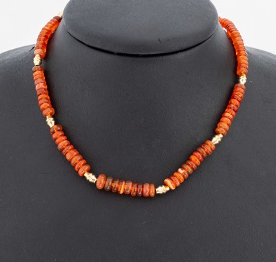 14 kt Gold Feueropal-Collier, GG 585/000, Feueropal-Linsen im Verlauf, D. ca. 3.9-6.8 mm, kl. Zwischenglieder, L. ca. 45 cm, Federringschließe