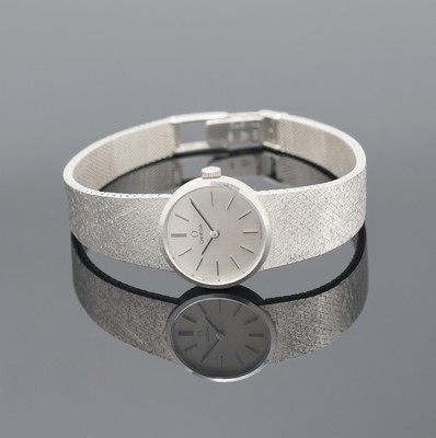 OMEGA Damenarmbanduhr in WG 585/000 Referenz 7280, Schweiz um 1973, Handaufzug, Boden aufgedr., orig. Milanaiseband, silb. Zifferbl. m. aufgel. Ind. ...