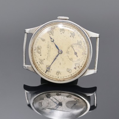 IWC Armbanduhr in Stahl mit Kaliber 83 in seltener Ausführung, Schweiz um 1936, Handaufzug, 3 tlg.-Geh., Boden u. Glasrand aufgedr., silb. Zifferbl. ...