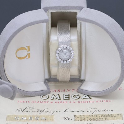 OMEGA seltene diamantbes. Backwinder-Damenuhr in WG 750/000 mit original Box und Papier, Schweiz verk. Dezember 1955, Handaufzug, 2- tlg. Geh. m. ...