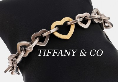 TIFFANY & CO Armband, 925er Silber, herzf. Glieder, 1 Glied GG 750/000, L. ca. 19 cm, Steckschließe, sign.