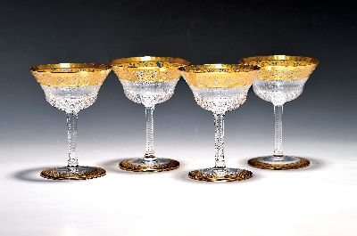 7 Champagnerschalen, Saint Louis, Dekor Thistle, farbloses Kristallglas, breit geätzte Goldbordüre, H. 13 cm